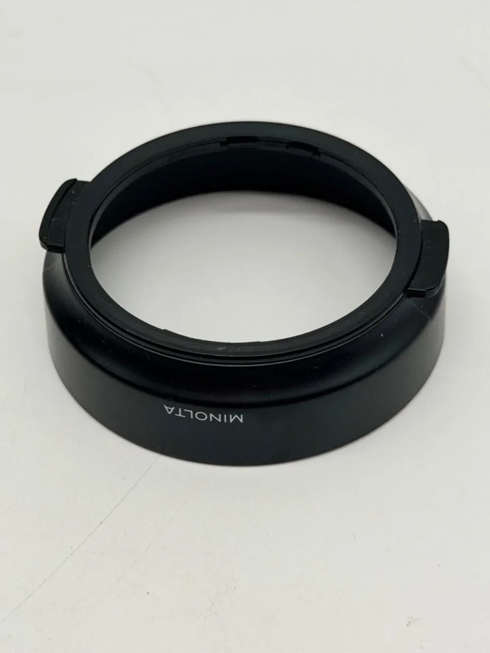 Minolta snap-on plastic lens hood specifically designed for the 35-70mm f/4 AF 